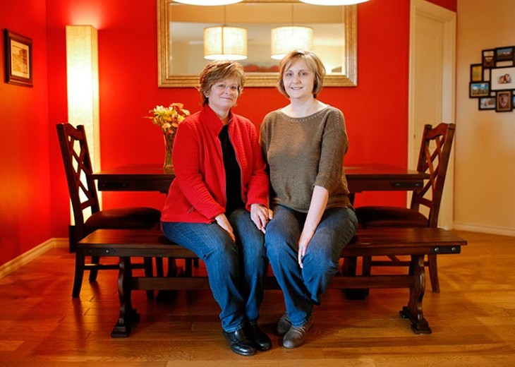 Debra Martin and Janette Thornbrue pose for a portrait at their home in Edmond, Sunday, Jan. 24, 2016. - GARETT FISBECK