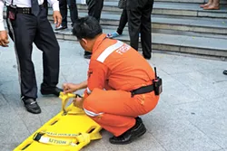 Bangkok Thailand - November 20 2015 : Many working people preparedness for fire drill or other disaster at office in Bangkok Thailand - BIGSTOCK