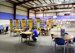 Patrons inside the temporary location for the Capitol Hill Library, 330 S.W. 24th Street, Oklahoma City.  A groundbreaking for a new library is planned for 8-27-16 at 327 S.W. 27th Street. - MARK HANCOCK