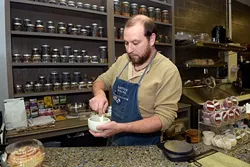 Doug Rader makes a spice mix at Native Roots Market in Oklahoma City, Tuesday, Nov. 29, 2016. - GARETT FISBECK