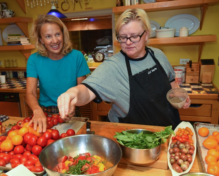 Kamala Gamble, left, with her chef, Barbara Mock during food prep in her home recently.  mh