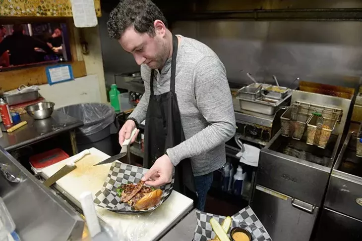 Ned Shadid works in the kitchen at Ned's Kitchen, Monday, Dec. 19, 2016. - GARETT FISBECK