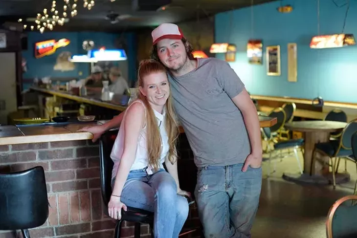 ?Michelle Simer and Tanner Miller pose for a photo at Blue Bonnet Bar, Friday, April 14, 2017. - GARETT FISBECK