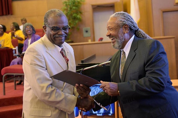 Larry Jeffries presented a citation of recognition to Booker Roberts, one of the NAACP Minute Men Commandos, during the 59th Oklahoma City Sit-In Anniversary at Fifth Street Baptist Church earlier this month. (Garett Fisbeck)