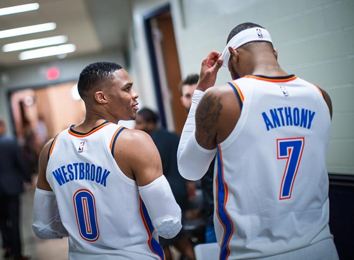 Russell Westbrook speaks with teammate Carmelo Anthony, who was acquired through a trade with the New York Knicks in September. (Zach Beeker / Oklahoma City Thunder / provided)