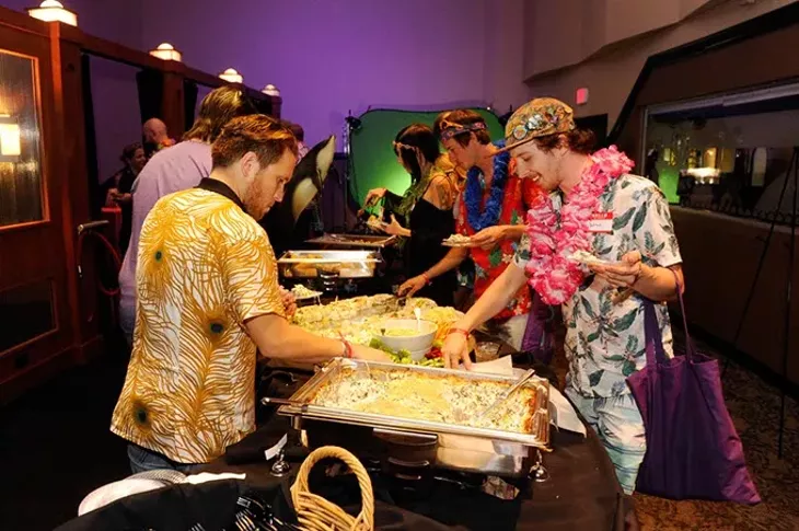 Best of OKC party guests mob the buffet at Will Rogers Theatre during the Aug. 23 appreciation event.