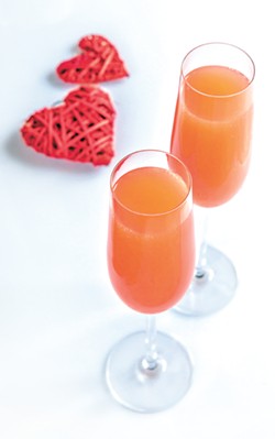 Two bellini cocktails with hearts on the white background - BIGSTOCK