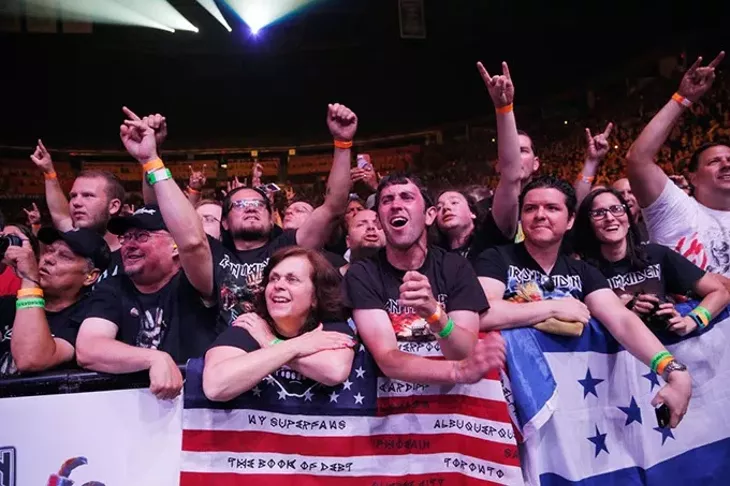 Fans react as Iron Maiden performs at the Chesapeake Energy Arena, Monday, June 19, 2017. - GARETT FISBECK