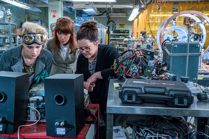 Erin (Kristen Wiig) comes to talk to Abby (Melissa McCarthy) and Holtzmann (Kate McKinnon) at the Paranormal Studies Lab at the Higgin's Institute in Columbia Pictures' GHOSTBUSTERS. - HOPPER STONE, SMPSP