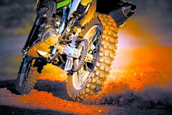 action of enduro motorcycle on dirt track - BIGSTOCK
