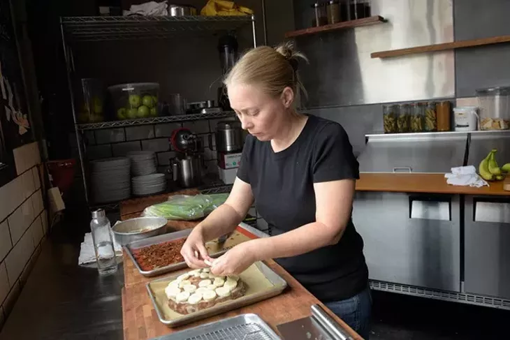 Hilary Roper makes a banana toffee cake at Derailleur in Yukon, Tuesday, Aug. 23, 2016. - GARETT FISBECK