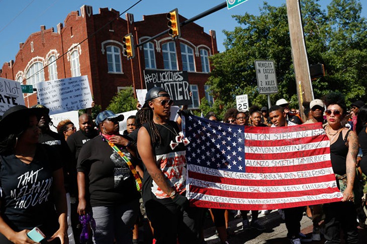 Protesters march during a Black Lives Matter demonstration in Oklahoma City, Sunday, July 10, 2016. - GARETT FISBECK