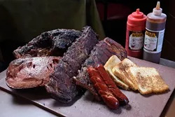 Ribs, brisket, hot links, and bologna, at Leo's BBQ, Monday, Dec. 5, 2016. - GARETT FISBECK