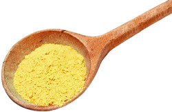 Nutritional yeast flakes in a wooden spoon isolated on white with clipping path included. - BIGSTOCK