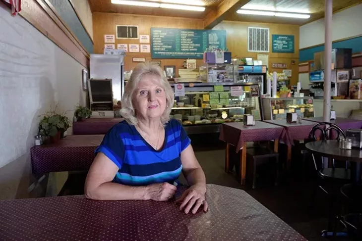 Peggy Carty poses for a photo at Someplace Else Deli, Monday, Sept. 19, 2016. - GARETT FISBECK