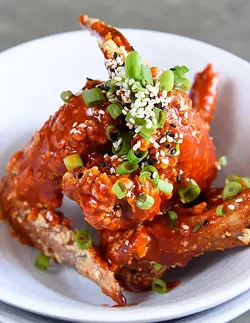 Chicken Wings in spicy sauce at Chae Modern Korean, Wednesday, May 11, 2016. - GARETT FISBECK
