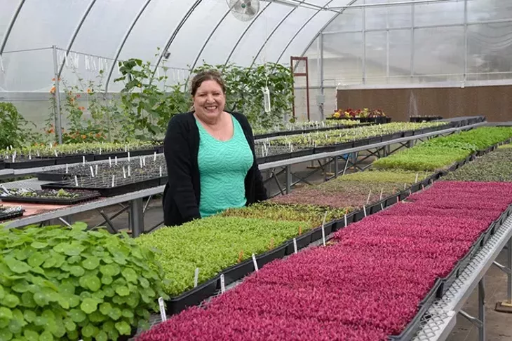 Julia Laughlin poses for a photo at Prairie Earth Gardens, Tuesday, April 4, 2017. - GARETT FISBECK