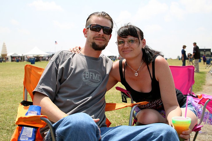 Justin Parker and his girlfriend Amanda Tracey sit in lawn chairs west of the main stage at Rocklahoma in Pryor, Okla. on Saturday, May 27, 2017. It was the couple's first year at Rocklahoma. (Cara Johnson).