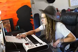 Local rapper and painter Chief Peace (aka Hippy Kid) at his home studio, Monday, July 18, 2016. - GARETT FISBECK