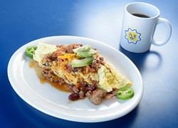Omelet with bacon, avocado, jalapeno and cheddar covered in chili, at Sunnyside Diner, Tuesday, Jan. 17, 2017. - GARETT FISBECK