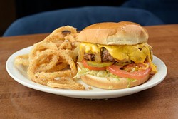 Classic burger with cheese and everything at Nic's Place, Tuesday, May 16, 2017. - GARETT FISBECK
