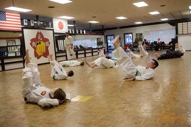A class does exercises at Chris Fay’s Okinawa Karate School. (Garett Fisbeck)