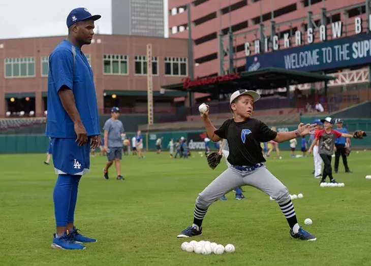 Fabio Castillo works with William Frazier during a recent OKC Dodgers Clinic in conjunction with Supermercados Morelos. - GARETT FISBECK