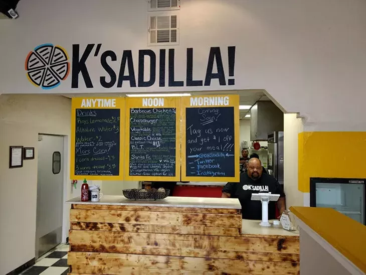 OK’sadilla! owner Charles Griffis works the register. | Photo Greg Elwell