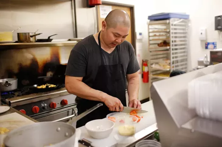 Chef Vuong Nguyen in the kitchen at Bonjour in Oklahoma City, Wednesday, July 29, 2015. - GARETT FISBECK