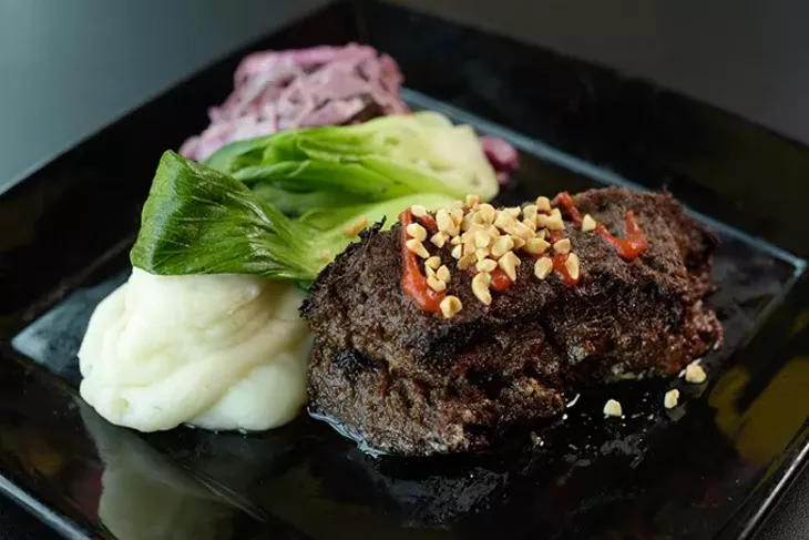 Braised beef cheek with Sriracha caramel sauce, wasabi whipped potatoes and bok choy (Garett Fisbeck)