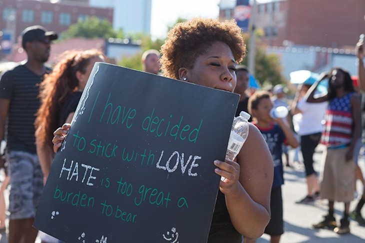 Protestors hold signs at the Black Lives Matter Protest on Sunday, July 10, 2016 in Oklahoma City. - EMMY VERDIN