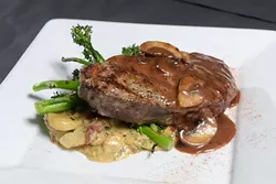 NY Strip in whiskey mushroom demiglace at The Mantel Wine Bar and Bistro Tuesday, June 27, 2017. - GARETT FISBECK