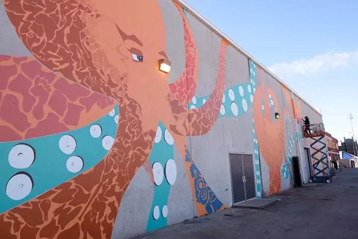 Jack Fowler works on his mural in Bricktown, Thursday, Dec. 1, 2016. - GARETT FISBECK