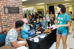 The University of Central Oklahoma’s Interfaith Faith returns to campus from 11 a.m. to 2 p.m. Aug. 25. Pictured, representatives from Edmond’s Spring Creek Assembly of God speak to a student during 2015 fair. Photo by UCO Photo Services/KT King - UCO PHOTO SERVICES/KT KING