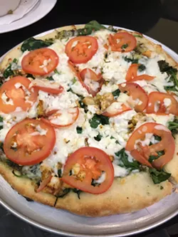 Sergio’s pizza crust is made in-house and baked on a pizza stone. | Photo Jacob Threadgill