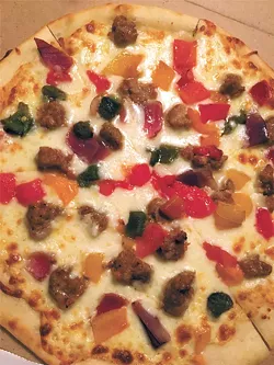 The sausage and pepper pizza is one of two on the menu that is served without sauce. | Photo Jacob Threadgill