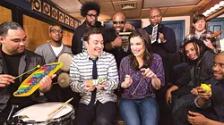The Roots perform “Let It Go” using only classroom instruments with (center) Jimmy Fallon and Idina Menzel on The Tonight Show Starring Jimmy Fallon. (Photo YouTube / provided)