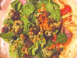 The Brogan Vegan pizza is baked and then topped with spinach, falafel and a red pepper sauce. (Photo Jacob Threadgill)