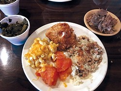 A pass through the buffet includes macaroni and cheese, candied yams, black-eyed peas with rice, fried chicken, neck bones and collard greens. - PHOTO BY JACOB THREADGILL