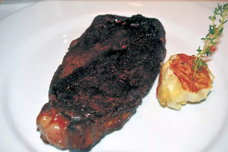 A wagyu rib-eye cooked in a cast iron skillet achieves a crunchy exterior at St. Mark’s Chop Room & Bar. | Photo Jacob Threadgill