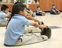 A Pierce Elementary School student stretches as part of a class taught by Oklahoma City Ballet.(Photo provided)