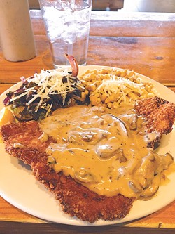 A new entree version of pork schnitzel is topped with mushroom gravy and joined by spaetzle and Brussels sprouts. | Photo Jacob Threadgill
