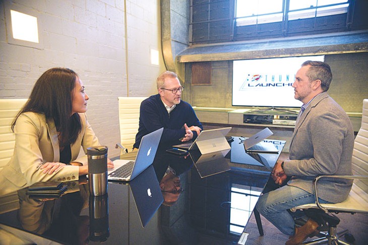 from left Erika Lucas, Brian Byrnes and Chris Lucas discuss Midtown&#146;s Thunder Launchpad, which will house a business accelerator program operated by StitchCrew. | Photo Laura Eastes