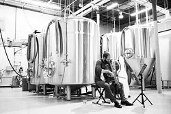 Cellist Steuart Pincombe performs during Anthem Brewing Company’s live music series. Shows can typically be seen Fridays and Saturdays at the brewery’s taproom. | Photo Nigel Bland Company / provided