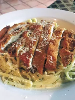 A lunch portion of linguine with pesto cream topped with a fried chicken cutlet | Photo Jacob Threadgill