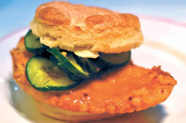 The Nashville sandwich is fried chicken covered in hot sauce and paired with honey mustard and bread-and-butter pickles. | Photo Aaron Snow / provided