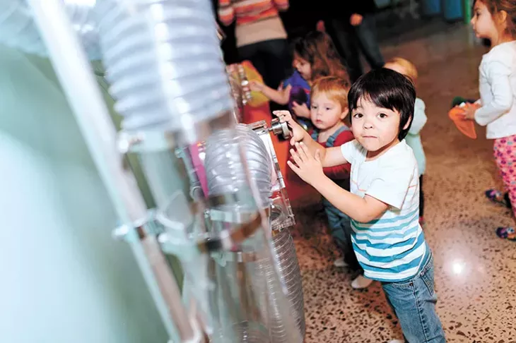 Children play with the air tubes at Okie Kids Playground, which opened in Edmond in January. - PHOTO COURTNEY DESPAIN / PROVIDED