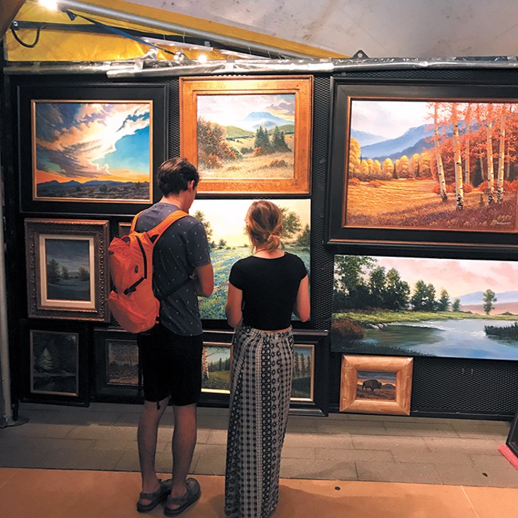 Guests peruse art at a recent Festival of the Arts - in Oklahoma City. - PROVIDED