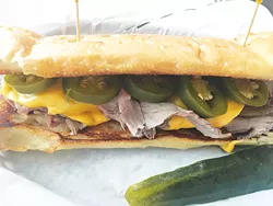 The APC is roast beef, caramelized onions, jalapeños and American cheese on garlic bread. - JACOB THREADGILL