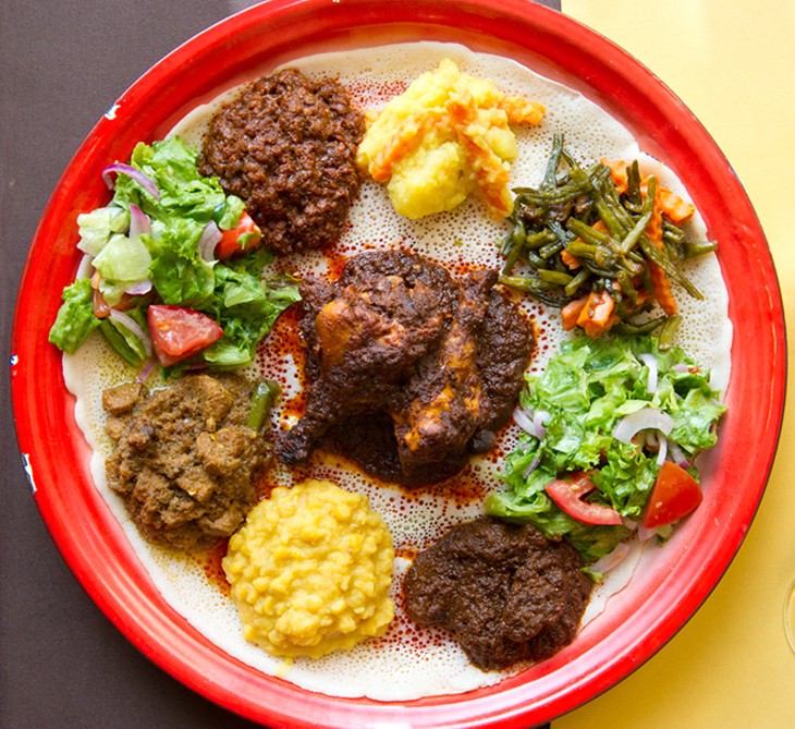 The Queen of Sheba messob includes three types of meat, string beans, potatoes, lentils, chickpeas and a salad. - JACOB THEADGILL